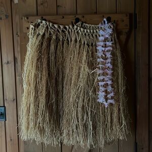 Hawaiian Weap around string tie grass skirt and Lai. One size fits all.